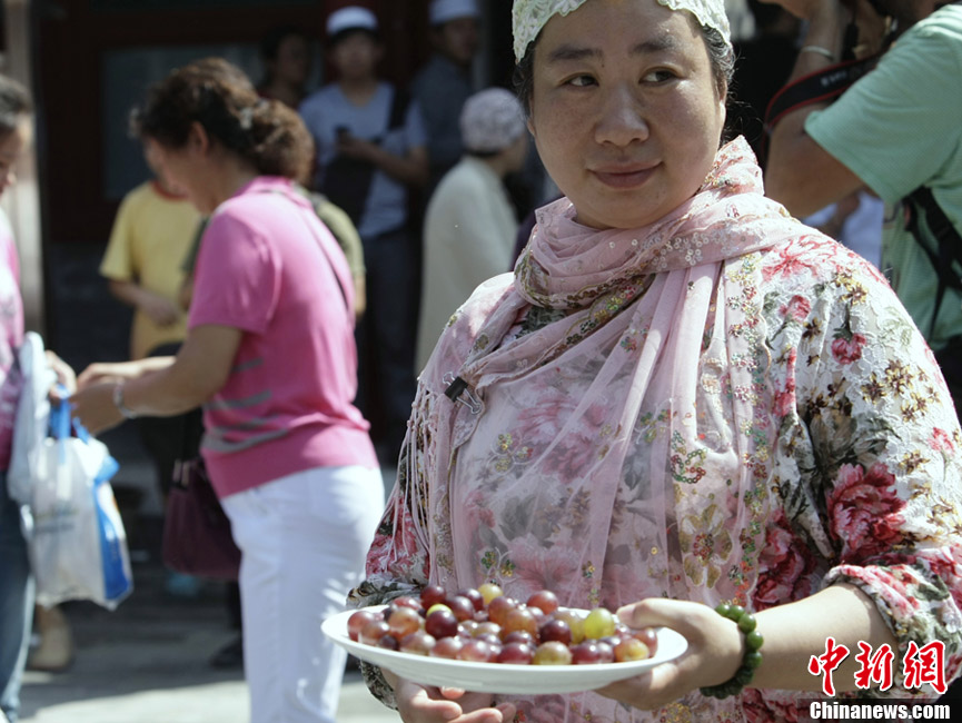 Muslims in China celebrate the end of Ramadan, the month of fasting, on Sunday, Aug. 19, 2012. Thousands of people crowded the Niujie Mosque in Beijing's Muslim quarter for Eid al-Fitr, or the Fast-Breaking Festival.