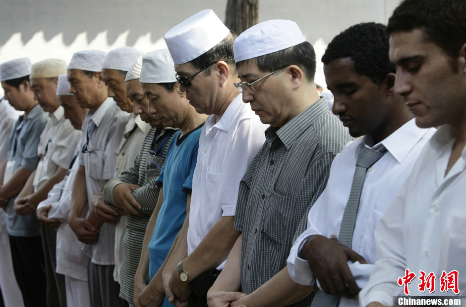 Muslims in China celebrate the end of Ramadan, the month of fasting, on Sunday, Aug. 19, 2012. Thousands of people crowded the Niujie Mosque in Beijing's Muslim quarter for Eid al-Fitr, or the Fast-Breaking Festival.