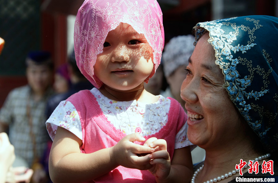 Muslims in China celebrate the end of Ramadan, the month of fasting, on Sunday, Aug. 19, 2012. Thousands of people crowded the Niujie Mosque in Beijing's Muslim quarter for Eid al-Fitr, or the Fast-Breaking Festival.