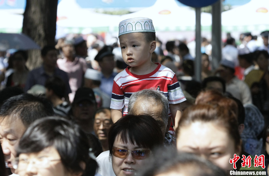 Muslims in China celebrate the end of Ramadan, the month of fasting, on Sunday, Aug. 19, 2012. Thousands of people crowded the Niujie Mosque in Beijing's Muslim quarter for Eid al-Fitr, or the Fast-Breaking Festival.