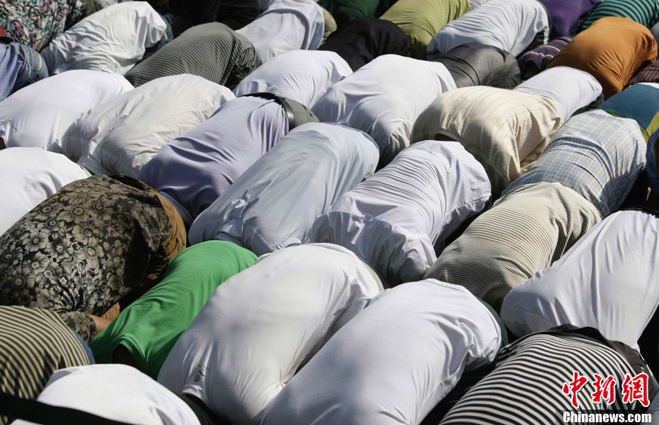 Muslims in China celebrate the end of Ramadan, the month of fasting, on Sunday, Aug. 19, 2012. Thousands of people crowded the Niujie Mosque in Beijing's Muslim quarter for Eid al-Fitr, or the Fast-Breaking Festival.