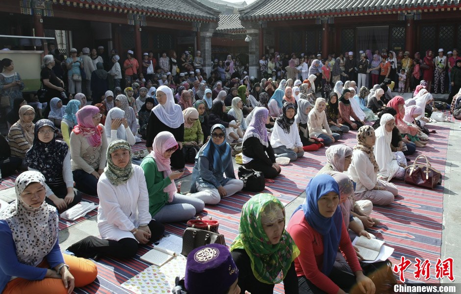 Muslims in China celebrate the end of Ramadan, the month of fasting, on Sunday, Aug. 19, 2012. Thousands of people crowded the Niujie Mosque in Beijing's Muslim quarter for Eid al-Fitr, or the Fast-Breaking Festival.