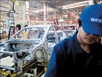 An employee works on an Emgrand 7 series production line at Geely Automobile Holdings Ltd's factory in Cixi, Zhejiang Province in this file photo. Geely Automobile Holdings has said it aims to become China's largest auto exporter in two years, overtaking Chery Automobile Co by focusing on expansion in developing countries. 