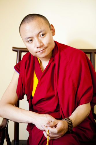 Tenzin Dorje, 30, a reincarnated Living Buddha at Yangri Gar Monastery in Lhasa, is called a 'modern Living Buddha' for his unconventional behavior and lifestyle. Provided to China Daily