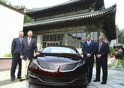 From left: Joe Hinrichs, president of Ford Asia-Pacific and Africa; Ford Motor's CEO Alan Mulally; Jim Farley, group vice president for global marketing, sales and service of Ford; and Dave Schoch, chairman and CEO of Ford China, pose with a Lincoln MKZ concept car in Beijing Tuesday. Ford Motor Co will launch its Lincoln brand in China within two years.