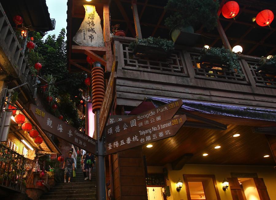 Photo taken on July 30, 2012 shows a signpost in the old street of Jioufen, southeast China's Taiwan.