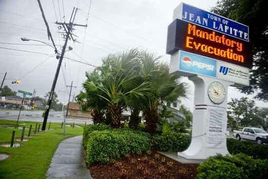 Hurricane Isaac is lashing New Orleans, flooding roads, damaging homes and stranding dozens.