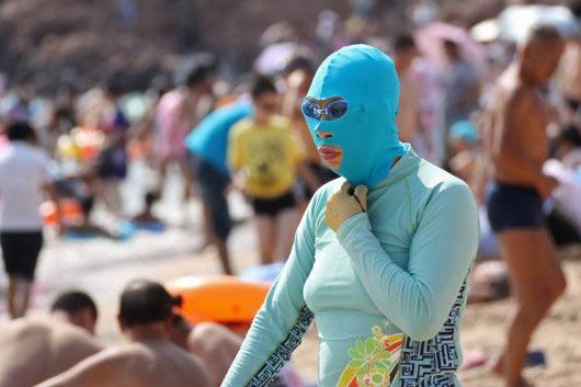'Facekinis'--a piece of nylon fabric with holes cut out for the eyes and mouth, used for sun protection. 