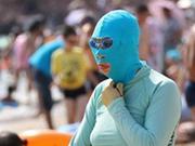 'Facekinis'--a piece of nylon fabric with holes cut out for the eyes and mouth, used for sun protection.