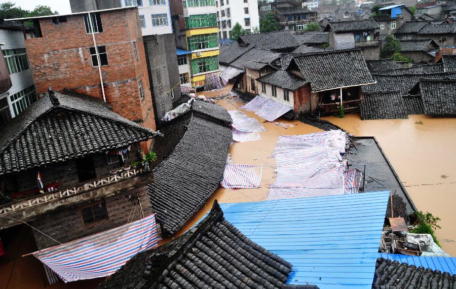 Floods besiege Enyang Town, Bazhong City, Sichuan Province, on Sept. 1, 2012. The heavy rainfalls since Aug. 30 caused floods in part of Sichuan Province, forcing 62,600 people to evacuate and destroying 8,500 houses.