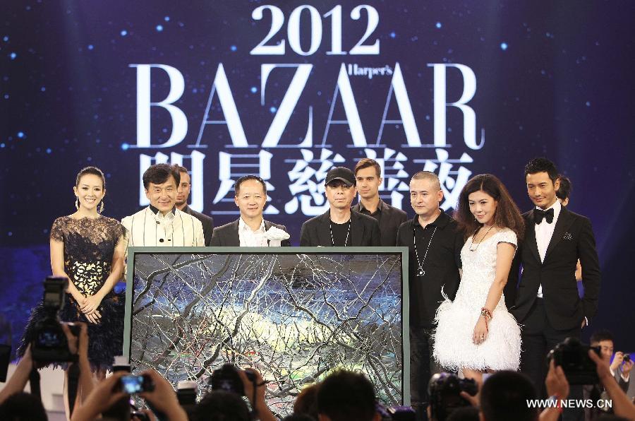 Guests attend the 2012 BAZAAR Stars Charity Night in Beijing, capital of China, Sept. 1, 2012. Chinese showbiz stars, entrepreneurs and celebrities attended the event which raised more than 40 million yuan (US$6.3 million) in Beijing on Saturday.