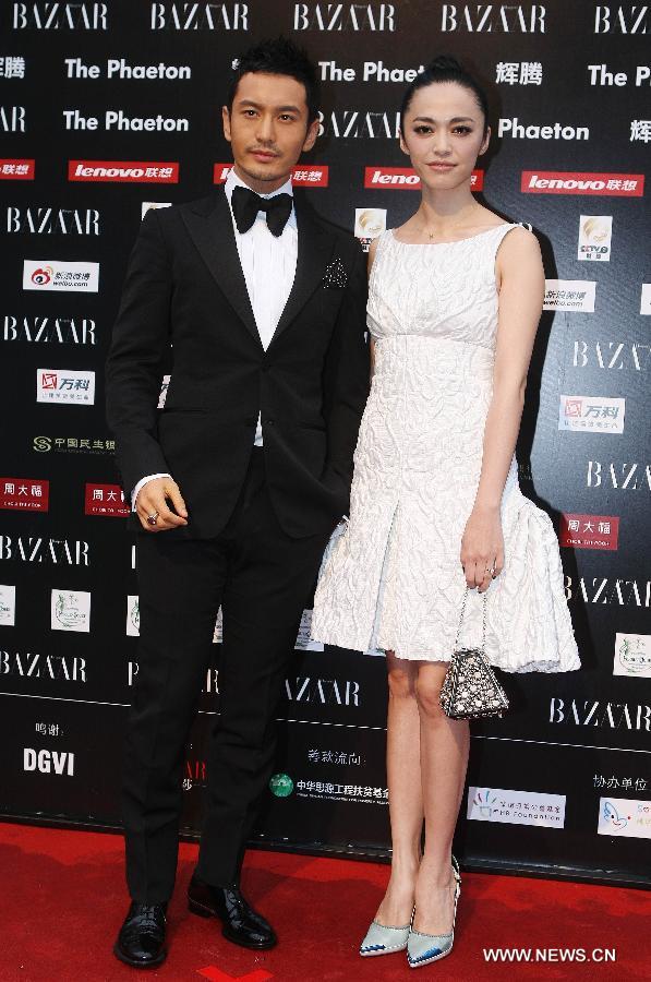 Actors Huang Xiaoming (L) and Yao Chen are seen at the 2012 BAZAAR Stars Charity Night in Beijing, capital of China, Sept. 1, 2012. Chinese showbiz stars, entrepreneurs and celebrities attended the event which raised more than 40 million yuan (US$6.3 million) in Beijing on Saturday.