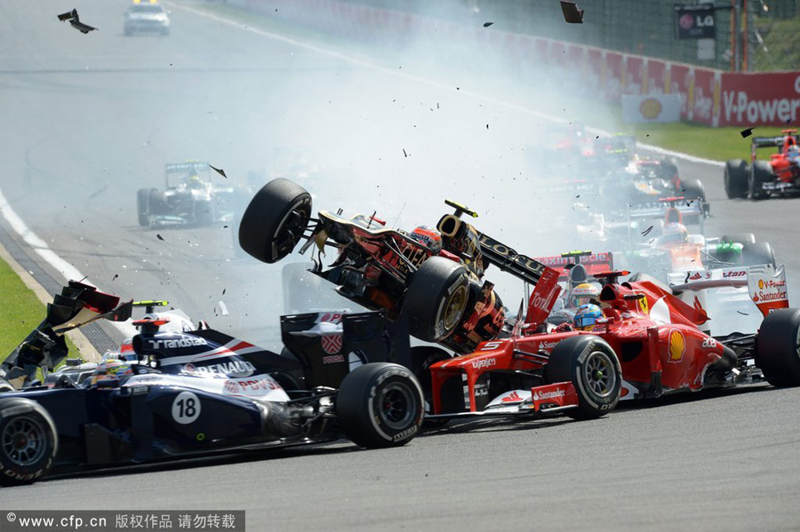 Lewis Hamilton of Mclaren and Fernando Alonso of Ferrari involved in the first corner crash during the start of the 2012 Belgium Formula One Grand Prix at the Spa-Francorchamps race track near Francorchamps, Belgium, Sept.2, 2012.