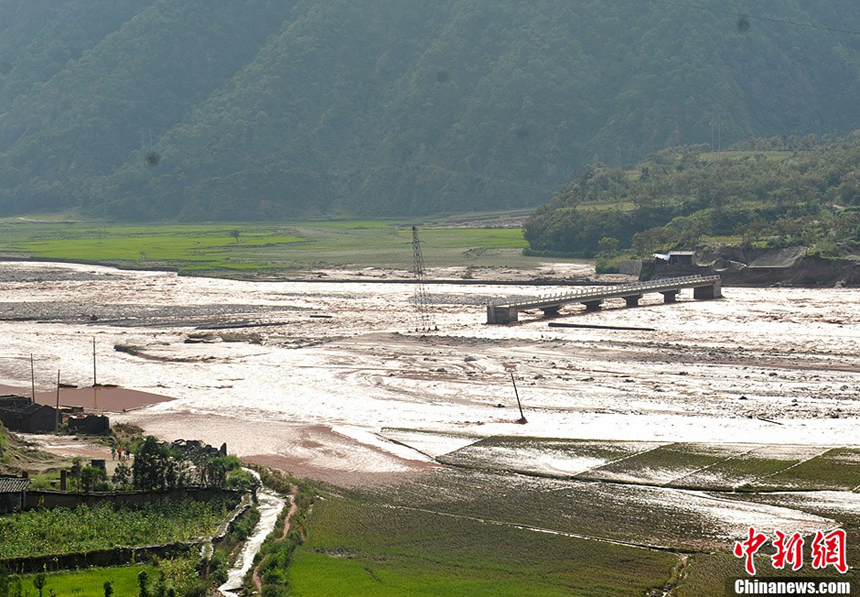 The floods gradually subside in Xide County, Sichuan Province, on Sept. 2, 2012. The floods have inundated more than 7,000 houses and caused power cut in the area. More than 100,000 have been affected by the floods, with one dead and two missing. 