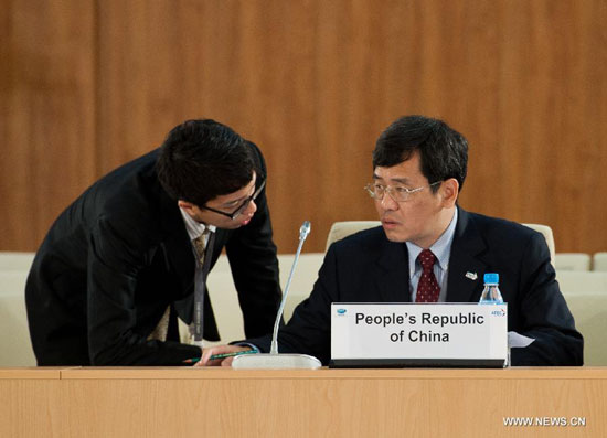 Tan Jian (R), official of Chinese Foreign Ministry, talks with his assistant before the APEC senior officials meeting in Vladivostok, Russia, on Sept. 2, 2012. The 2012 Asia-Pacific Economic Cooperation forum (APEC) opened on Sunday with its usual senior officials' meeting aimed at identifying issues for further discussion.