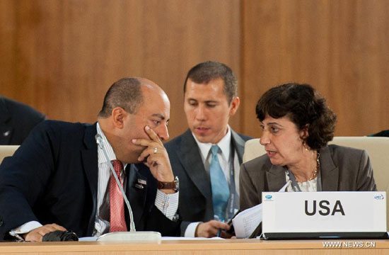 Participants from the United States talk during the APEC senior officials meeting in Vladivostok, Russia, on Sept. 2, 2012. The 2012 Asia-Pacific Economic Cooperation forum (APEC) opened on Sunday with its usual senior officials' meeting aimed at identifying issues for further discussion.