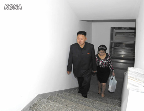 North Korea's top leader Kim Jong Un and his wife Ri Sol Ju visit working people's new flats in Changjon Street, according to the country's official news agency KCNA's report on Sept. 5, 2012.[Xinhua/KCNA]