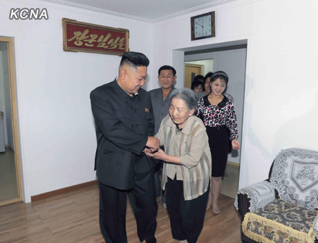 North Korea's top leader Kim Jong Un and his wife Ri Sol Ju visit working people's new flats in Changjon Street, according to the country's official news agency KCNA's report on Sept. 5, 2012.[Xinhua/KCNA]