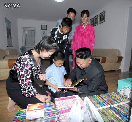 North Korea's top leader Kim Jong Un and his wife Ri Sol Ju visit working people's new flats in Changjon Street, according to the country's official news agency KCNA's report on Sept. 5, 2012.[Xinhua/KCNA]