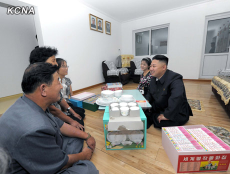 North Korea's top leader Kim Jong Un and his wife Ri Sol Ju visit working people's new flats in Changjon Street, according to the country's official news agency KCNA's report on Sept. 5, 2012.[Xinhua/KCNA]