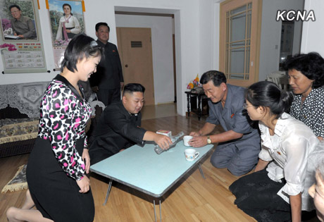 North Korea's top leader Kim Jong Un and his wife Ri Sol Ju visit working people's new flats in Changjon Street, according to the country's official news agency KCNA's report on Sept. 5, 2012.[Xinhua/KCNA]