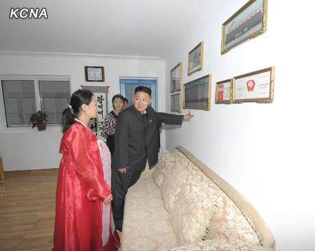 North Korea's top leader Kim Jong Un and his wife Ri Sol Ju visit working people's new flats in Changjon Street, according to the country's official news agency KCNA's report on Sept. 5, 2012.[Xinhua/KCNA]