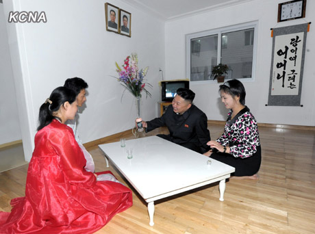 North Korea's top leader Kim Jong Un and his wife Ri Sol Ju visit working people's new flats in Changjon Street, according to the country's official news agency KCNA's report on Sept. 5, 2012.[Xinhua/KCNA]
