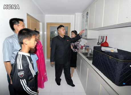 North Korea's top leader Kim Jong Un and his wife Ri Sol Ju visit working people's new flats in Changjon Street, according to the country's official news agency KCNA's report on Sept. 5, 2012.[Xinhua/KCNA]