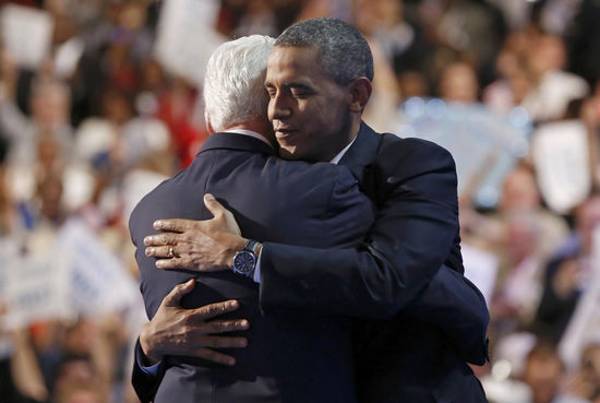 US President Barack Obama (R) embraces former President Bill Clinton onstage after Clinton nominated Obama for re-election during the second session of the Democratic National Convention in Charlotte, North Carolina, September 5, 2012. [Agencies] 