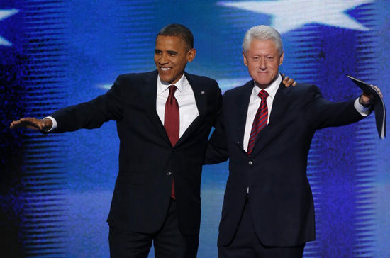 US President Barack Obama (L) joins former President Bill Clinton onstage after Clinton nominated Obama for re-election during the second session of the Democratic National Convention in Charlotte, North Carolina, September 5, 2012. [Agencies] 