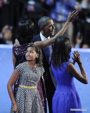 U.S. President Barack Obama celebrate with his family at the Democratic National Convention in Charlotte Sept. 6, 2012. U.S. President Barack Obama on Thursday night formally accepted the Democratic Party's presidential nomination, offering his own 'harder but better path' to rejuvenate support just two months ahead of the November election. [Zhang Jun/Xinhua] 