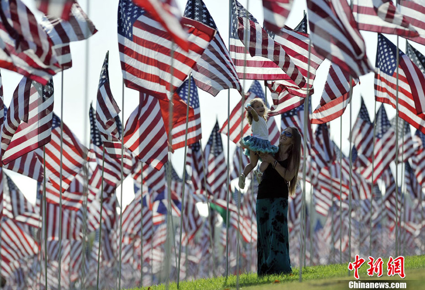 3,000 US national flags are erected by students and staff from Pepperdine University to honor victims of the 9/11 attacks, in Malibu on September 9, 2012. 