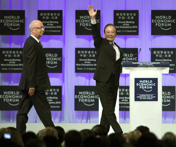 Premier Wen Jiabao and Klaus Schwab, founder of the World Economic Forum, attend the opening ceremony of the Annual Meeting of the New Champions 2012, also known as the Summer Davos, which is taking place in Tianjin.[Photo/ China Daily]