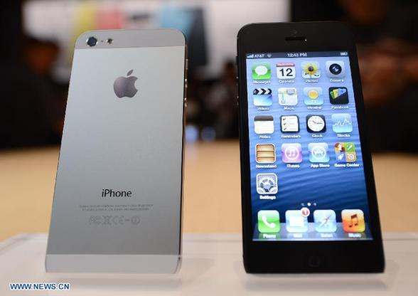 The new iPhone 5 is displayed during an Apple special event in San Francisco, the United States, Sept. 12, 2012. Apple on Wednesday unveiled iPhone 5, its latest generation of smartphone that features bigger display and support for faster LTE wireless network. [Xinhua] 