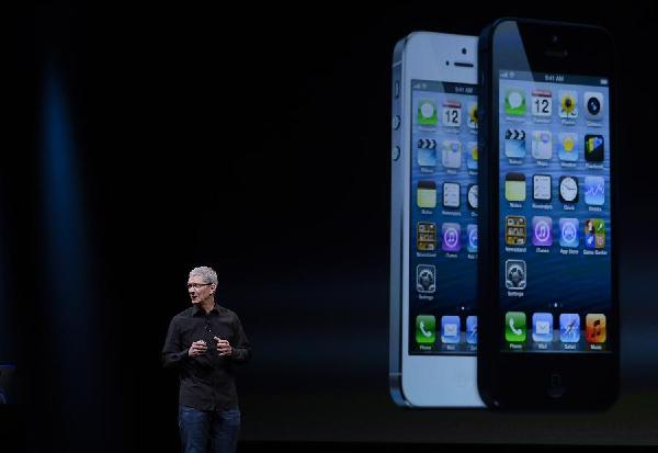 Apple Chief Executive Officer Tim Cook announces the new iPhone 5 at a press event in San Francisco, the United States, Sept. 12, 2012. Apple on Wednesday unveiled iPhone 5, its latest generation of smartphone that features bigger display and support for faster LTE wireless network. [Photo/Xinhua]