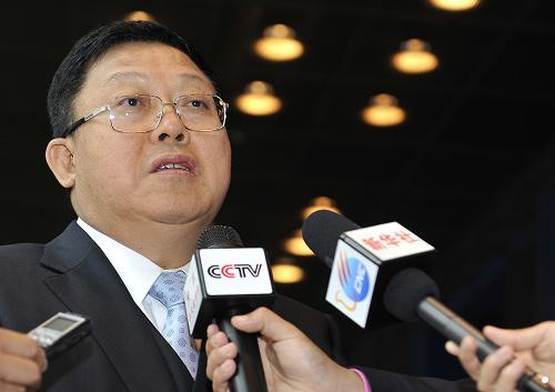 Chong Quan, deputy representative for China's international trade talks, receives media interviews after talks with Jean-Luc Demarty, the European Commission's Director General for Trade in Brussels on September 14.
