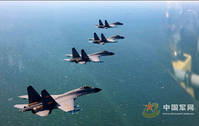 Crews at an air unit of the Jinan Military Region pilot new-type fighters J-11B in a live ammunition drill to enhance operation capabilities, as part of China's recent efforts to step up its military exercises.[Photo/chinamil.com.cn] 