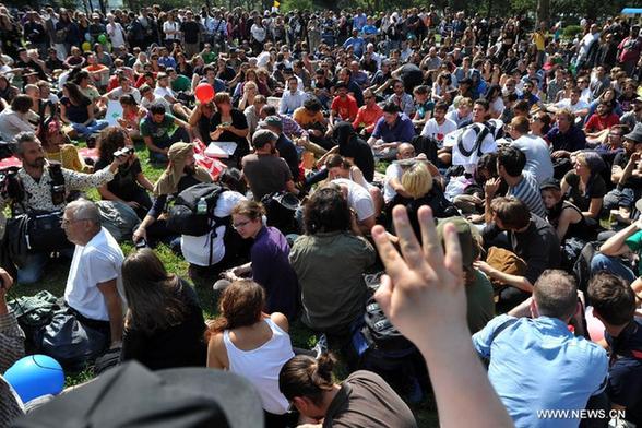 Members of 'Occupy Wall Street' protest during the one-year anniversary of the movement in New York, the United States, on Sept. 17, 2012. 