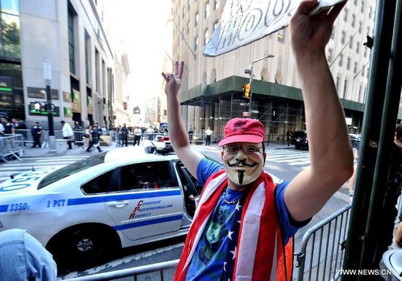 A member of 'Occupy Wall Street' protests during the one-year anniversary of the movement in New York, the United States, on Sept. 17, 2012. 