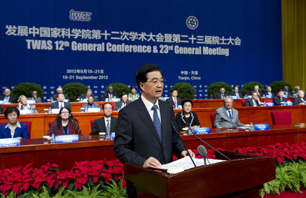 Chinese President Hu Jintao (front) addresses the opening ceremony of the 12th General Conference and the 23rd General Meeting of the Academy of Science for the Developing World (TWAS) in Tianjin, north China, Sept. 18, 2012.[Photo/Xinhua]