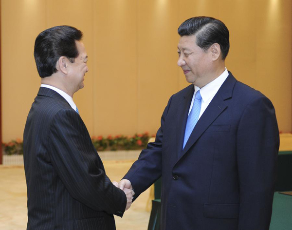 Chinese Vice President Xi Jinping (R) meets with Vietnamese Prime Minister Nguyen Tan Dung as they attend the 9th China-ASEAN (Association of Southeast Asian Nations) Expo in Nanning, capital of south China's Guangxi Zhuang Autonomous Region, Sept. 20, 2012. [Xie Huanchi/Xinhua]