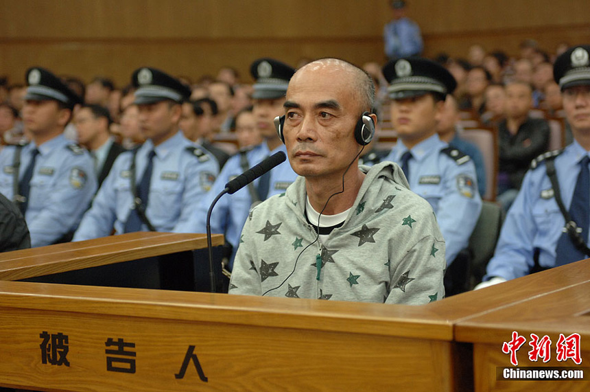 Naw Kham and five other suspects, charged with the murders of 13 Chinese sailors, appear in court in Kunming, Yunnan Province, on Thursday. 