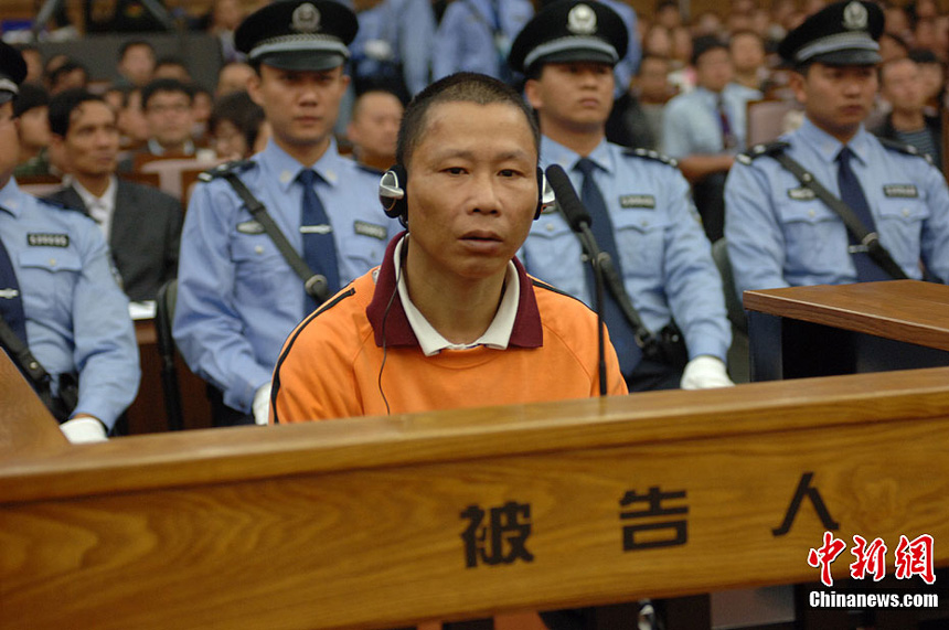 Naw Kham and five other suspects, charged with the murders of 13 Chinese sailors, appear in court in Kunming, Yunnan Province, on Thursday. 