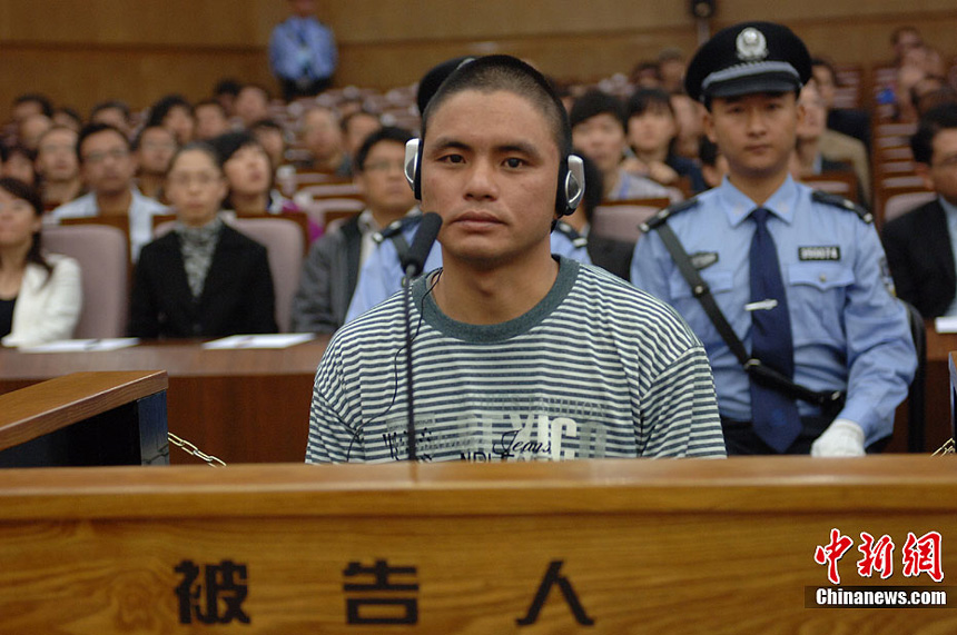 Naw Kham and five other suspects, charged with the murders of 13 Chinese sailors, appear in court in Kunming, Yunnan Province, on Thursday. 