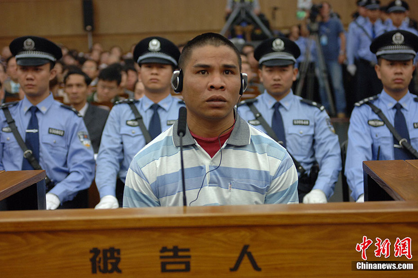 Naw Kham and five other suspects, charged with the murders of 13 Chinese sailors, appear in court in Kunming, Yunnan Province, on Thursday. 