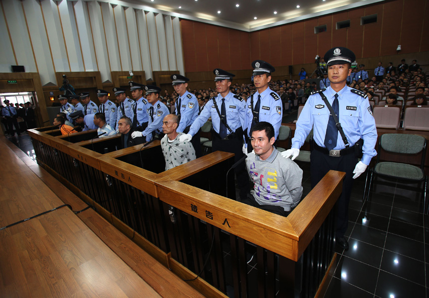 Naw Kham and five other suspects, charged with the murders of 13 Chinese sailors, appear in court in Kunming, Yunnan Province, on Thursday.