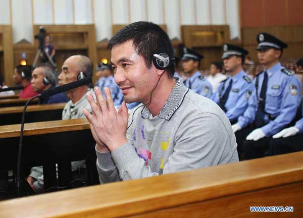 Naw Kham is seen at the Intermediate People's Court of Kunming, capital of Yunnan Province, Sept. 21, 2012. Naw Kham, principal suspect for the murders of 13 Chinese sailors on the Mekong River last year, pleaded guilty Friday evening when he and five other people were standing trial in southwest China. [Wang Shen/Xinhua]