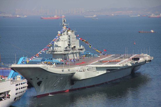 China's first aircraft carrier held a flag-raising ceremony yesterday, amid rising tensions over the Diaoyu Islands in the East China Sea.
