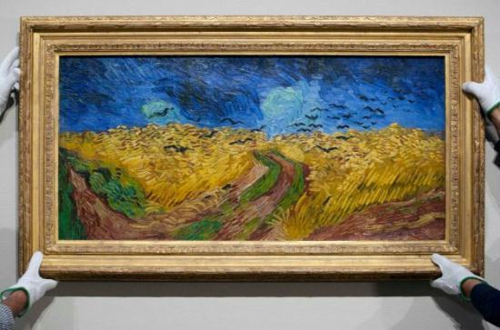 Curators remove Vincent van Gogh's painting 'Wheatfield with Crows,' from the wall of the Van Gogh Museum in Amsterdam, Netherlands, Sunday, Sept. 23, 2012.