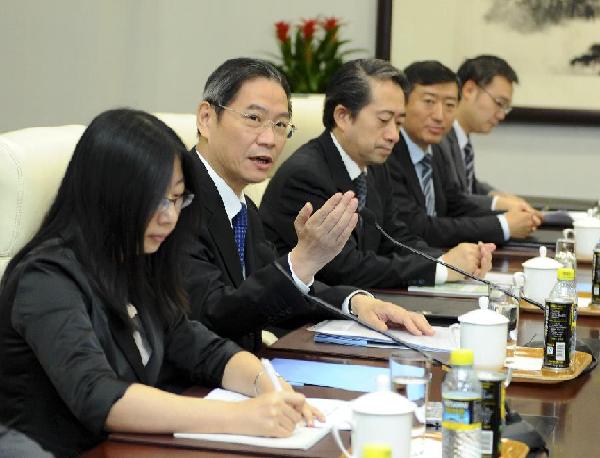 Chinese Vice Foreign Minister Zhang Zhijun (2nd L) holds talks with Japanese Deputy Foreign Minister Chikao Kawai (not pictured) on bilateral relations, especially on the issue concerning the Diaoyu Islands, in Beijing, capital of China, Sept. 25, 2012. [Xie Huanchi/Xinhua]